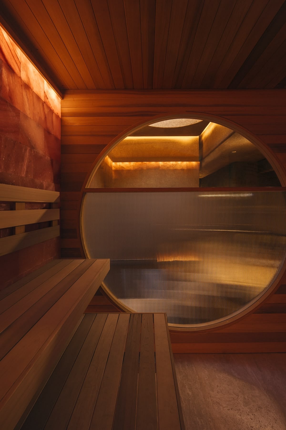 Warm wooden sauna with a round window
